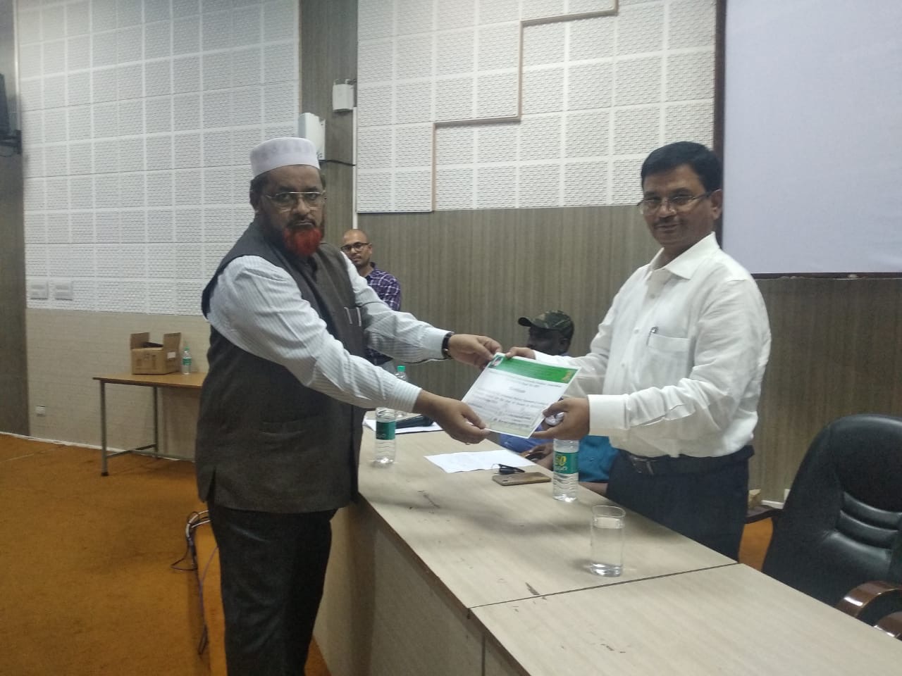 Prof. Badiuddin Ahmed presenting certificate to Prof. P. H. Mohammad.