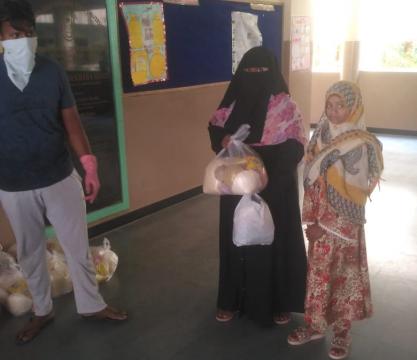 Distribution of Ration by MANUU Model School Staff