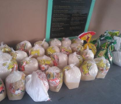 Distribution of Ration by MANUU Model School Staff