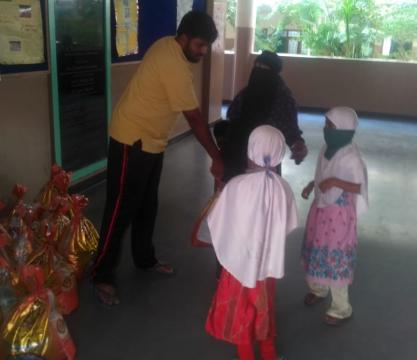Distribution of Ration by MANUU Model School Staff
