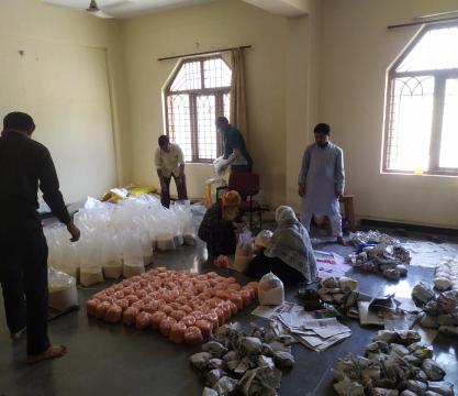 Distribution of Ration by MANUU Model School Staff