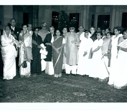 Group photo taken during the “At Home” given by Maulana Abul Kalam Azad, Central Minister for Education, in honour of the Members of the Central Social Welfare Board at Rashtrapati Bhavan, New Delhi, on November 25, 1953, shows Shrimati Indira Gandhi, Mrs. Huthee Singh, Shrimati Durgabai Deshmukh (Chairman of the Board), Shrimati Maniben Patel, Mrs. Manmohani Sehgal and others with the Education Minister. 