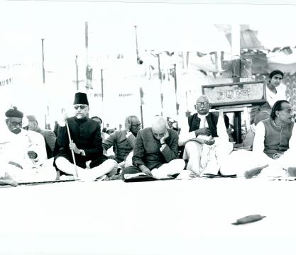 A close-up of the Leaders seated on the dais at the open session of the Indian National Congress held at Gandhinagar on December 18-19, 1948. From left to right: the Hon’ble Shri M. S. Aney, Governor of Bihar, the Hon’ble Maulana Abul Kalam Azad, Minister for Education, Government of India, the Hon’ble Pandit Jawaharlal Nehru, Prime Minister of India, Dr. Pattabhi Sitaramayya, Congress President, Acharya J. B. Kripalani, Member of  the Working Committee of the Congress and Shri Purshotamdas Tandon, Presiden