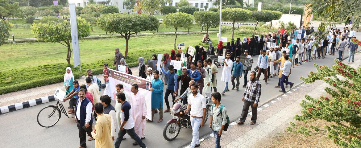Azad Walk PVC: Prof Ayub Khan addressing the participants of Azad Walk at IMC. Prof. Noushad Husain, Prof. Mohammad Fariyad, Mr. Abid Abdul Wasay and others are also seen.