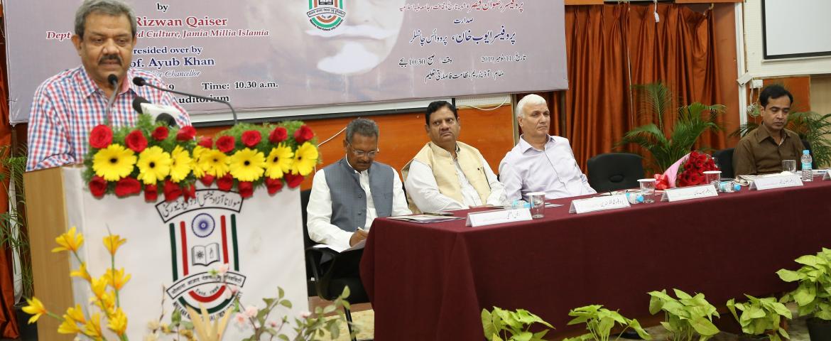  Dias and audience: Prof. Rizwan Qaiser delivering Azad Memorial lecture. Others are also seen.