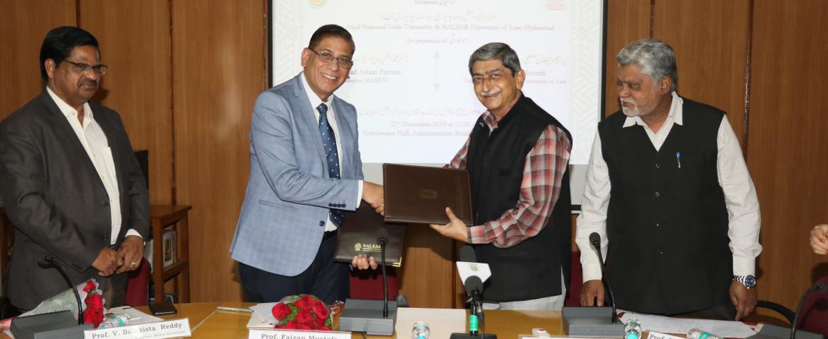 Exchange: Dr. Mohammad Aslam Parvaiz and Prof. Faizan Mustafa exchanging the MoU. Prof. S. M. Rahmatullah and Prof. V. Balakista Reddy are also seen.