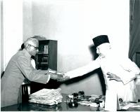Maulana Abul Kalam Azad, Union Education Minister receiving the first volume of ‘Vijnanam’ the only popular encyclopaedia in Malaylam from Shri Mathew M. Kushifvelil, Managing Editor of the Encyclopaedia when he called on the Minister in New Delhi on April 20, 1957.